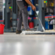 Side view of someone mopping warehouse floor
