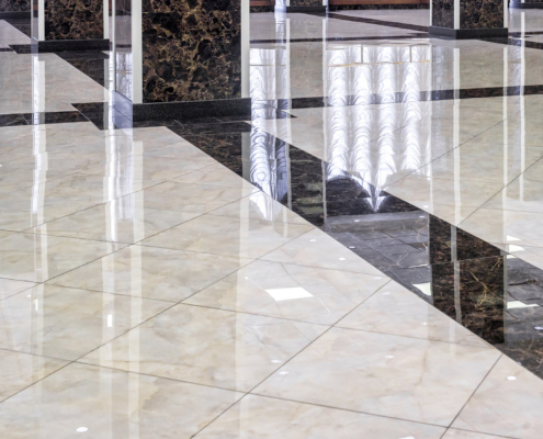 Clean shiny marble floor in commercial office, cleaning service concept